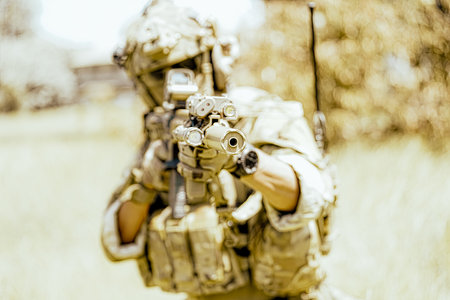 United States Army ranger during the military operation. Professional marine soldiers training with weapon on a military range.の写真素材
