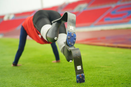 Athlete runner with prosthetic legs at track stadiumの写真素材