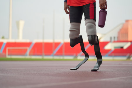 Athlete runner with prosthetic legs at track stadiumの写真素材