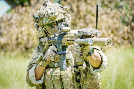 United States Army ranger during the military operation. Professional marine soldiers training with weapon on a military range.の写真素材