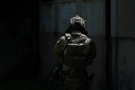 United States Army ranger during the military operation. Professional marine soldiers training with weapon on a military range.の写真素材