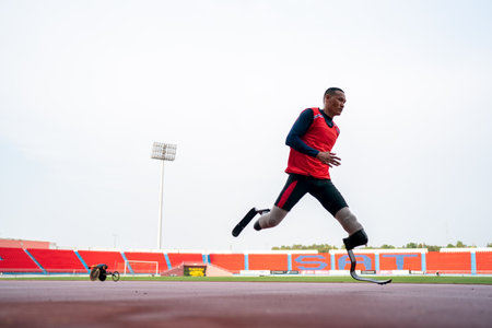 athlete runner physically disabled run on track of stadiumの写真素材