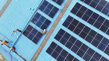 Aerial view of solar panels on the roof of a building.