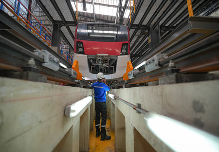 Workers on the production line of high-speed passenger trains in Moscow metro.