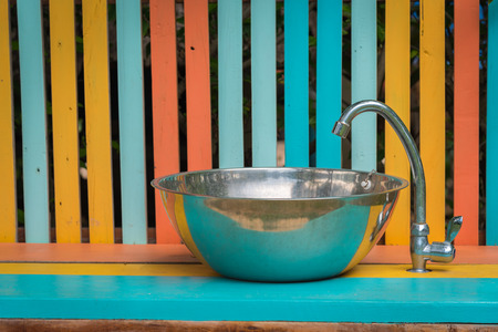 stainless sink on wooden top.の写真素材