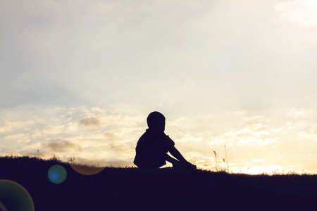 silhouette of a happy children and happy time sunset
