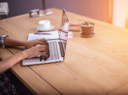 business woman writing something on notepad in office.の写真素材