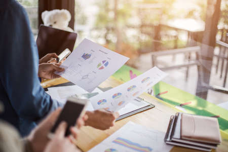 Business team working on laptop, while sitting at office. Business people.の写真素材