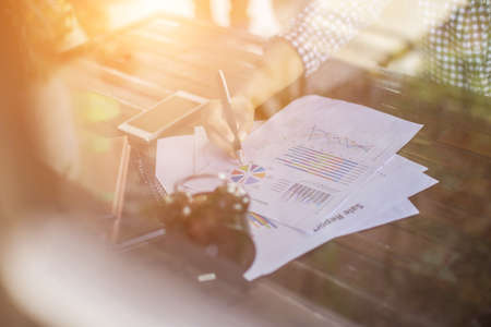 Business team working on laptop, while sitting at office. Business people.の写真素材