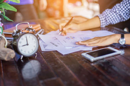Business team working on laptop, while sitting at office. Business people.の写真素材