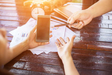 Business team working on laptop, while sitting at office. Business people.の写真素材