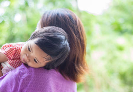 Mother holding her daughterの写真素材
