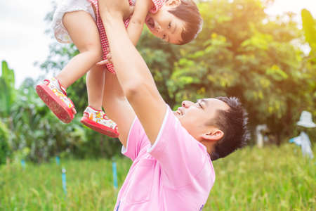 Piggyback of baby and dadの写真素材