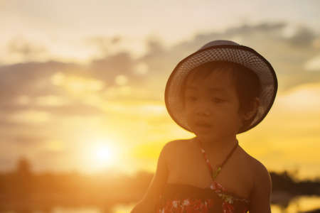 kid silhouette,Moments of the child's joy. On the Nature sunsetの写真素材