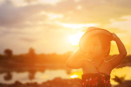 kid silhouette,Moments of the child's joy. On the Nature sunsetの写真素材