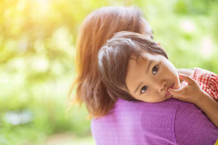 Mother holding her daughterの写真素材
