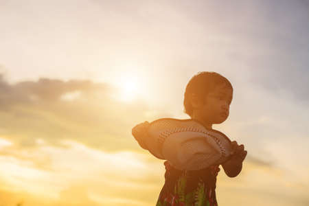 kid silhouette,Moments of the child's joy. On the Nature sunsetの写真素材