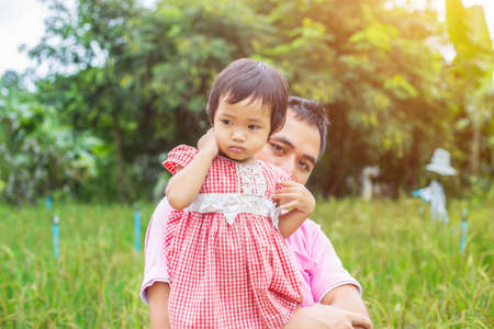 Piggyback of baby and dadの写真素材