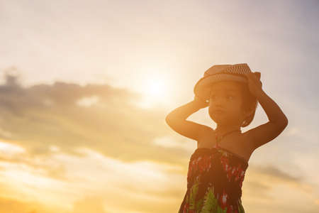 kid silhouette,Moments of the child's joy. On the Nature sunsetの写真素材