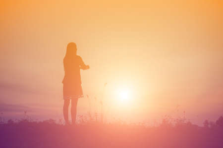Young woman raise hands up for her success, Concept of Success in life.の写真素材