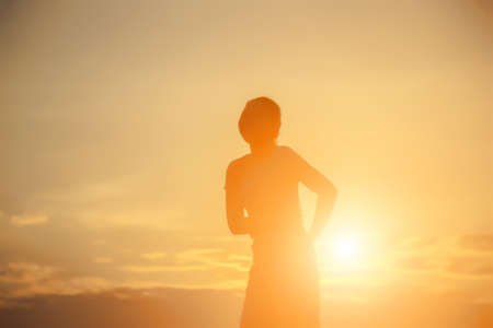 Young woman raise hands up for her success, Concept of Success in life.の写真素材