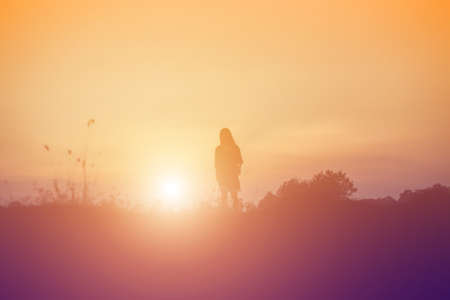 Young woman raise hands up for her success, Concept of Success in life.の写真素材