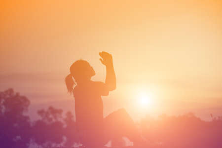 Sad and depressed woman sitting aloneの写真素材