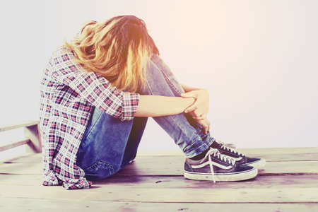 Sad woman hug her knee,nobodyの写真素材