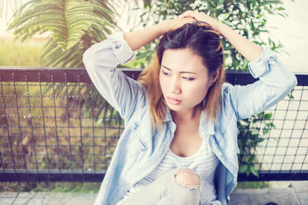 Sad woman hug her knee,nobodyの写真素材