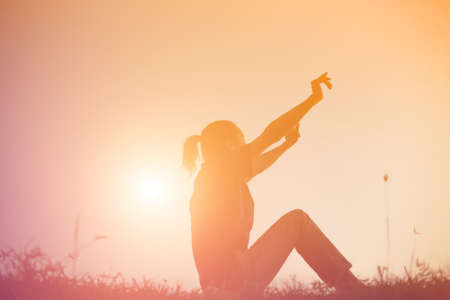 Sad and depressed woman sitting alone の写真素材