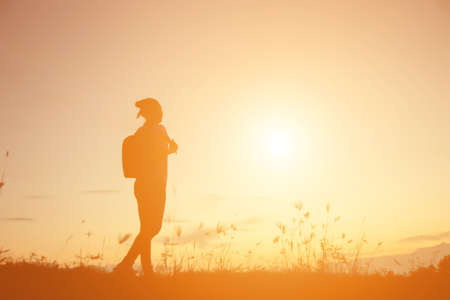 woman travelling in nature with backpackの写真素材