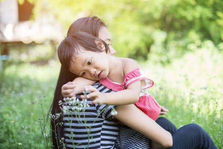 Mother holding her daughterの写真素材