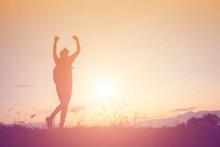 woman travelling in nature with backpackの写真素材