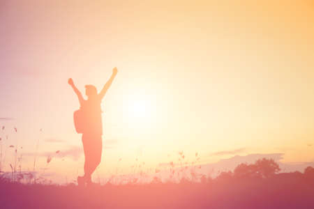 woman travelling in nature with backpackの写真素材