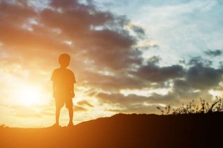 silhouette of a happy children and happy time sunsetの写真素材