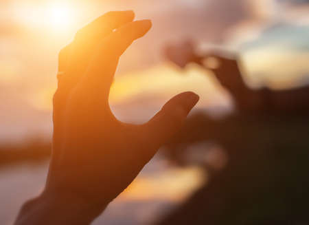 hands-shape for the Sun.の写真素材