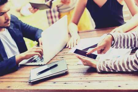 Business team working on laptop, while sitting at office. Business people.の写真素材