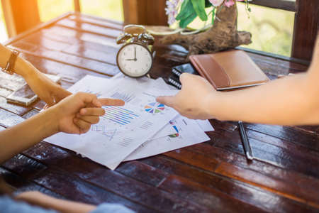 Business team working on laptop, while sitting at office. Business people.の写真素材