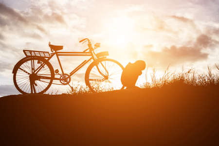 Biker family silhouette father and sonの写真素材