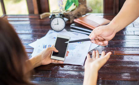 Business team working on laptop, while sitting at office. Business people.の写真素材