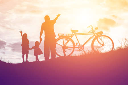 Biker family silhouette father and sonの写真素材