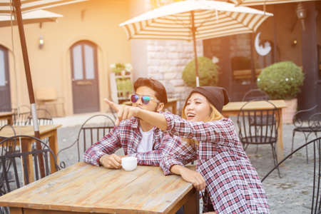 Group of young hipster sitting in a cafe,Young cheerful friends having fun while take time together, Holiday freedom enjoy.の写真素材