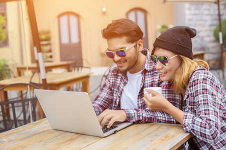 Group of young hipster sitting in a cafe,Young cheerful friends having fun while take time together, Holiday freedom enjoy.の写真素材