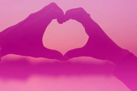 hands in shape of love heartの写真素材