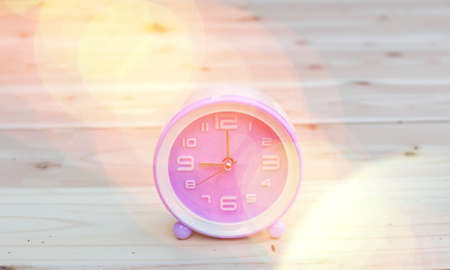 alarm clock with abstract nature bokeh blur background.の写真素材