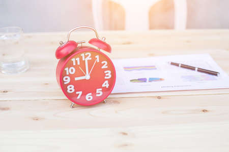 Hands of Businessman working on Laptop Computer with Data Chartsの写真素材