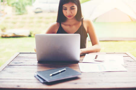 Business team working on laptop, while sitting at office. Business people.の写真素材