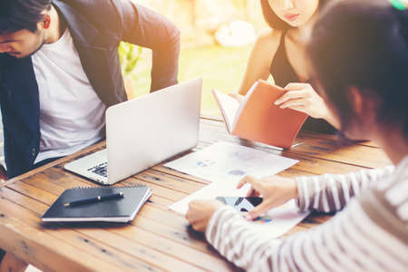 Business team working on laptop, while sitting at office. Business people.の写真素材