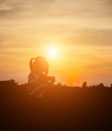 kid silhouette,Moments of the child's joy. On the Nature sunsetの写真素材