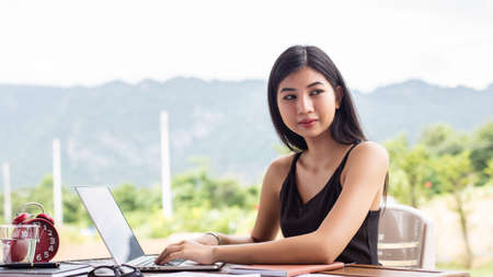 Business team working on laptop, while sitting at office. Business people.の写真素材